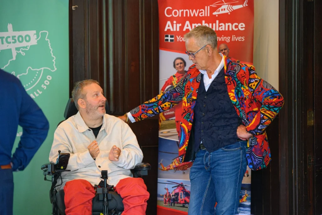 Clive Kessell leaning on Steven Webb talking on the launch of The Cornwall 500